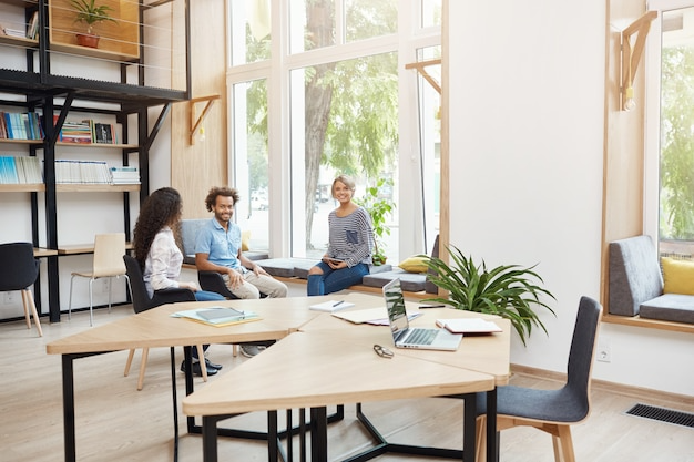 employees chatting in an office