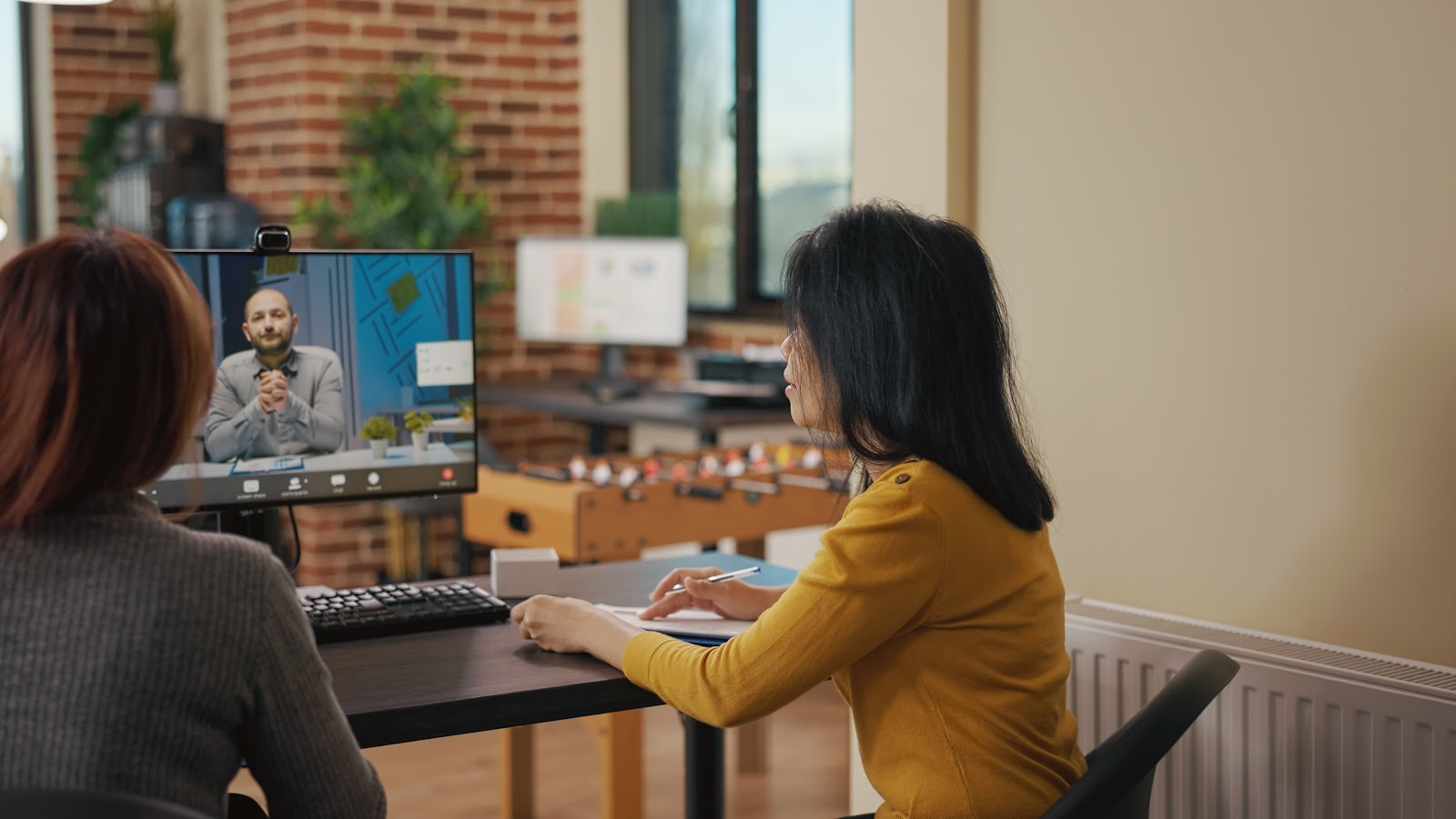 employees in an office having a virtual meeting