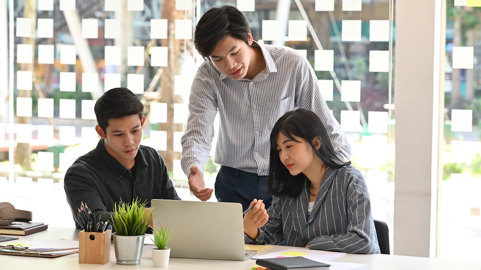 Team members working on a laptop