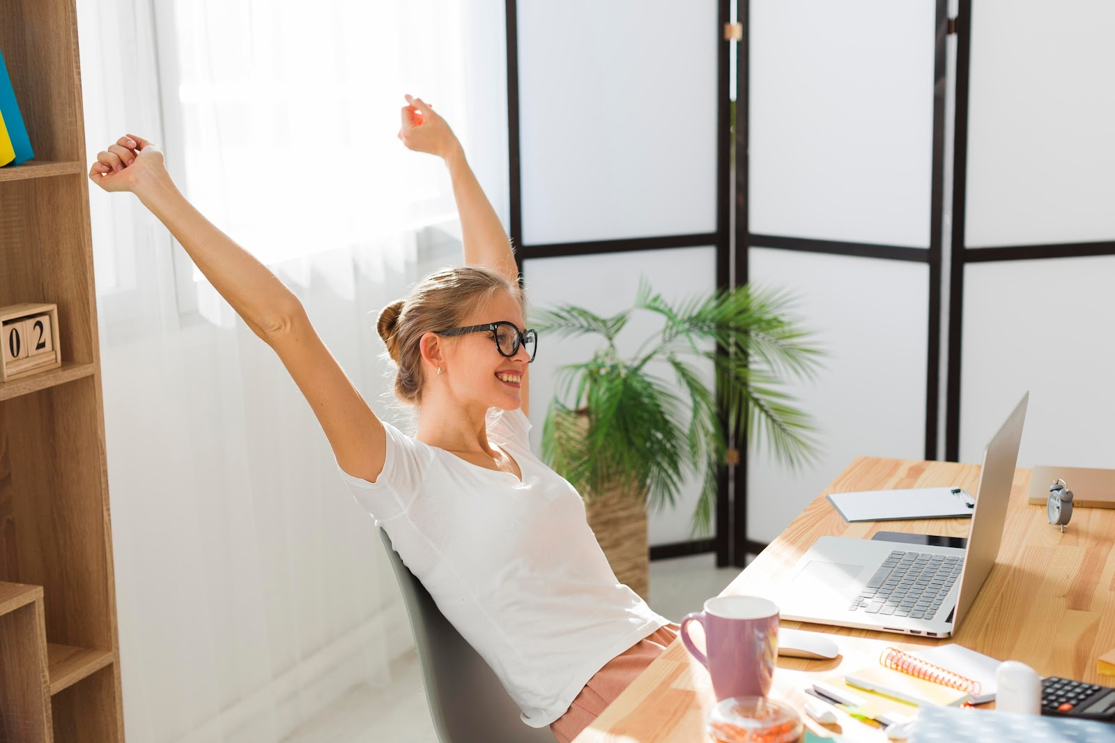 Woman celebrating a work achievement