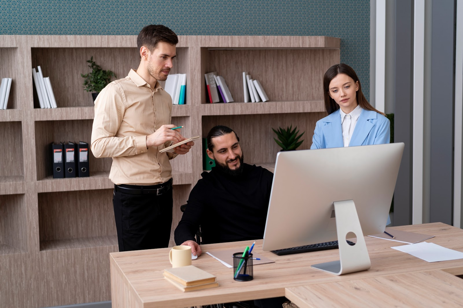 Colleagues looking at a monitor