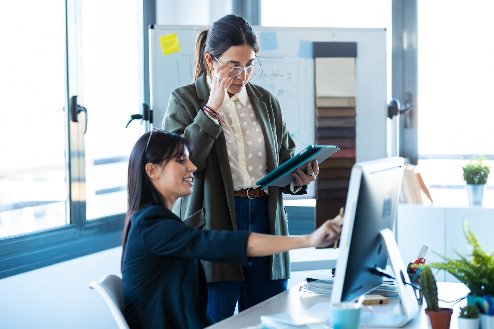 Business colleagues looking at devices