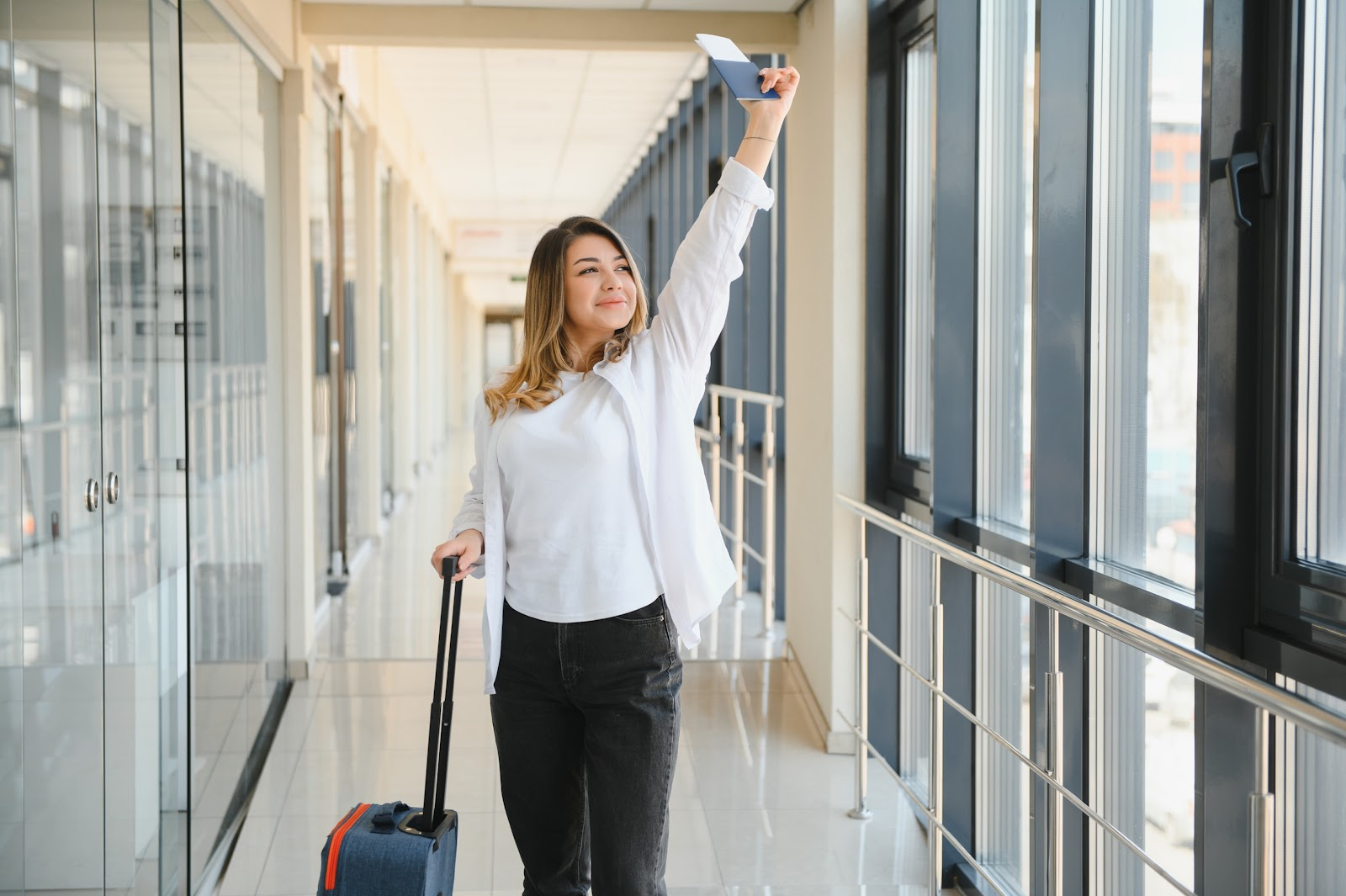 Woman holding an airplane ticket